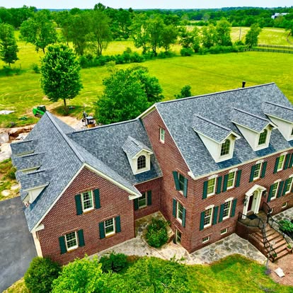 New shingle roof on a two story brick colonial home